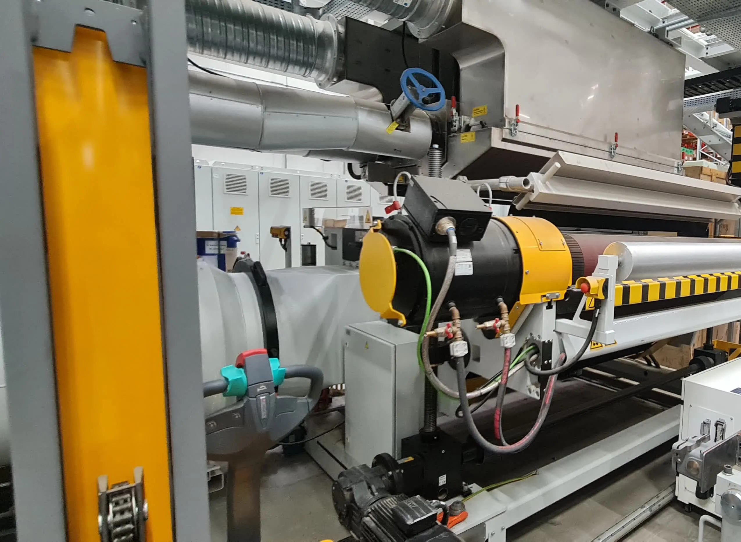Reifenhäuser Polyrema winder: drive motor and roller assembly with safety guarding