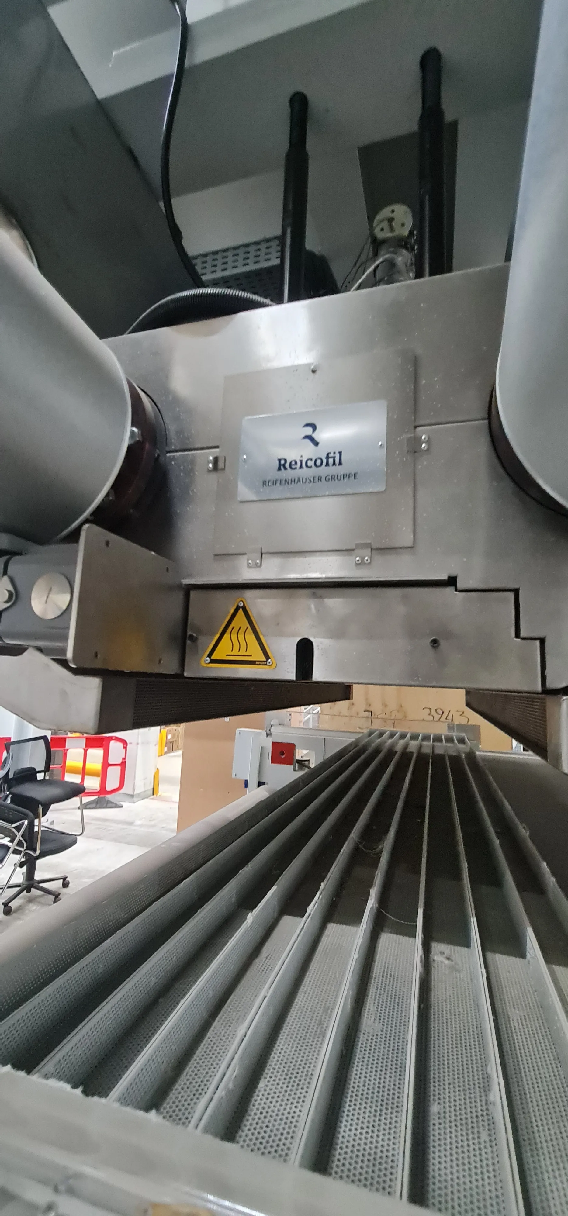 Reicofil nameplate beside a hot-surface warning label