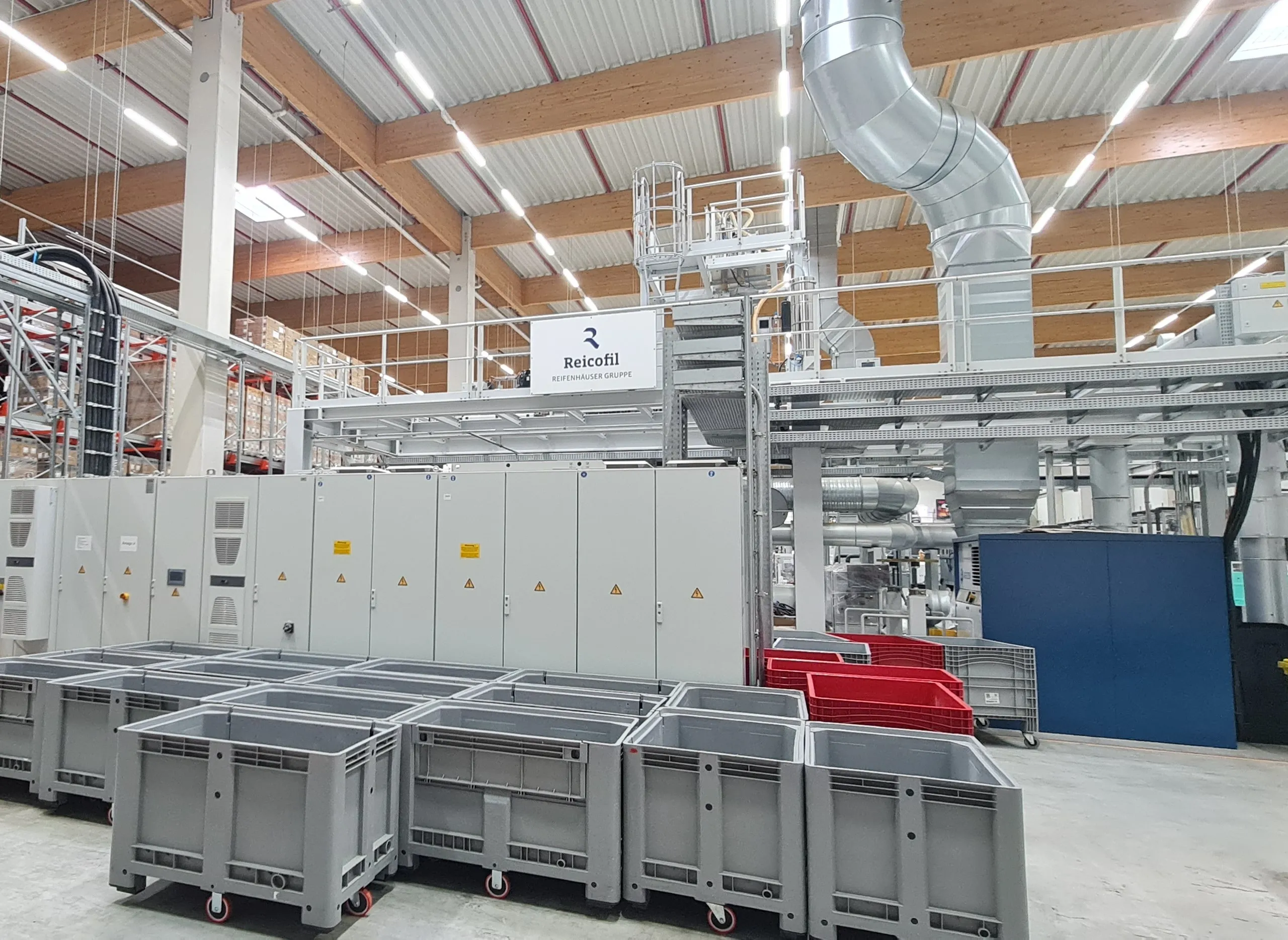 Line hall with mezzanine, exhaust ducting and control cabinets
